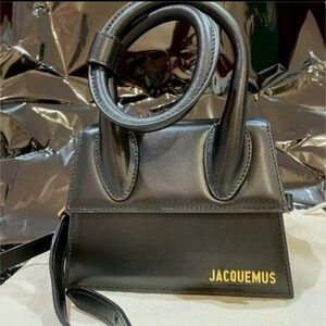 Jacquemus Elegant Black Crossbody Bag with Gold Accents